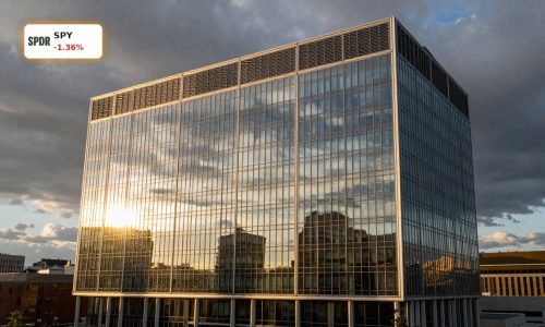 Modern corporate tower at sunset symbolizing Federal Reserve Rate Decision amid oil shock risk