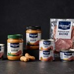 Hormel Foods Earnings spotlight branded packaged food products in a premium dark studio arrangement