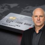 Premium Mastercard card close-up with global backdrop reflecting Mastercard Earnings and cross-border slowdown