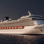 Norwegian Cruise Line ship at dusk symbolizing mixed Norwegian Cruise Line Earnings outlook
