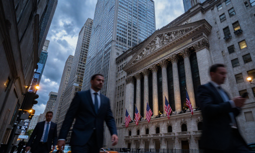 Wall Street financial district at dusk reflecting Fed-driven Stock volatility