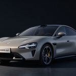 Xiaomi SU7 electric sedan in studio lighting symbolizing soaring Xiaomi EV Deliveries