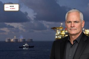 Exxon Mobil Iran War risk reflected in tense Middle East offshore oil and LNG facilities at dusk.